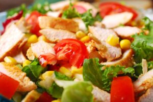 elle jay meal plan 300x201 - closeup on grilled chicken salad with cheese,vegetables and garlic sauce