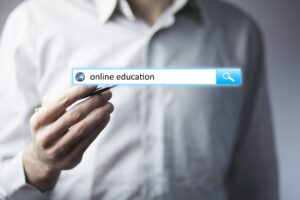 online education 300x200 - man hand touching online education text